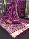 Magenta flowy dola silk saree with patola woven design border & lagdi patta pallu