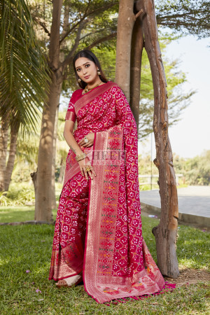 Pink color bandhej silk saree with zari weaving work