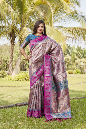 Rani pink color kanjivaram silk saree with zari weaving work