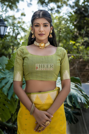 Yellow color tussar silk saree with zari weaving temple border