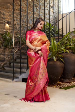 Soft flowy orange color tissue silk saree with contrast woven border & blouse
