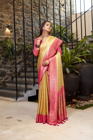 Soft flowy yellow color tissue silk saree with contrast woven border & blouse