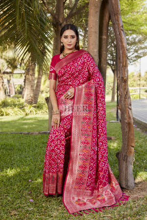 Pink color bandhej silk saree with zari weaving work
