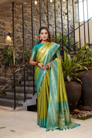 Soft flowy mahendi green color tissue silk saree with contrast woven border & blouse
