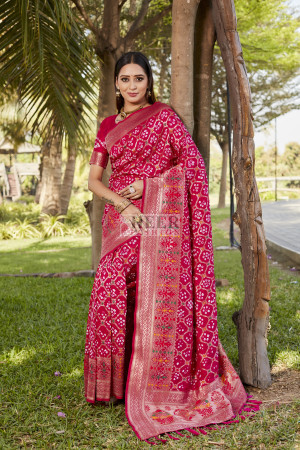 Pink color bandhej silk saree with zari weaving work