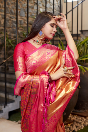Soft flowy orange color tissue silk saree with contrast woven border & blouse