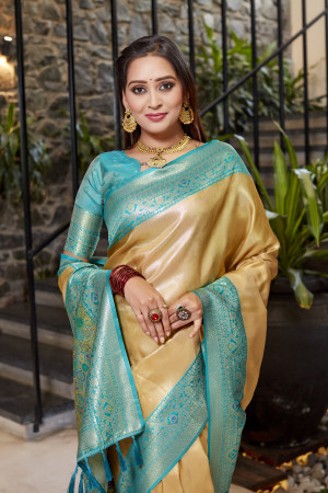 Soft flowy cream color tissue silk saree with contrast woven border & blouse