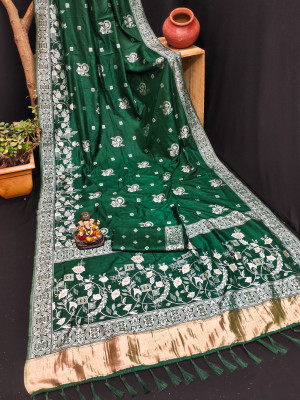 Flowy woven design with lagdi patta pallu bottle green color dola silk saree