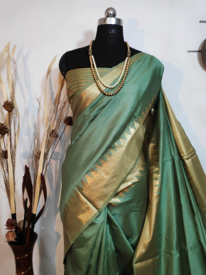 Rama green color aasam silk saree with zari weaving work