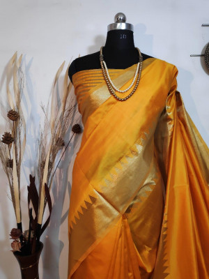 Yellow color aasam silk saree with zari weaving work