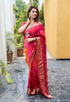 Pink and orange color bandhej silk saree with zari weaving work