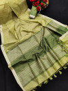 Pista green color metallic linen silk saree with zari work