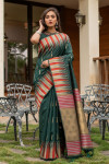 Green color pure tussar silk saree with ikkat woven border