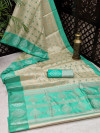 Sea green color art silk saree with satin woven border