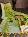 Parrot green color soft raw silk saree with woven work
