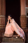 Peach color pure linen saree with zari woven border and pallu
