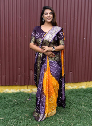 Purple and yellow color bandhej silk saree with zari weaving work