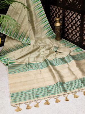 Beige color tussar silk weaving saree with ikat woven border