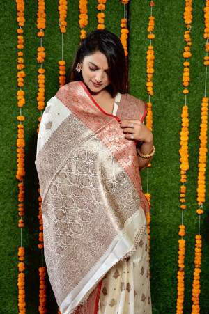 Off white color kanchi silk saree with zari work