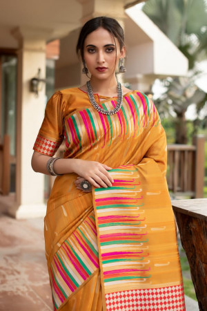 Mustard yellow color pure tussar silk saree with ikat woven border