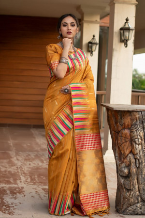 Mustard yellow color pure tussar silk saree with ikat woven border