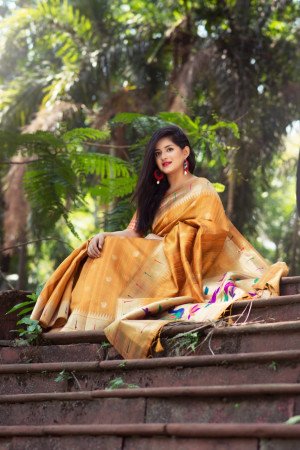 Yellow color paithani silk saree with zari woven work
