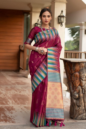 Magenta color pure tussar silk saree with ikkat woven border