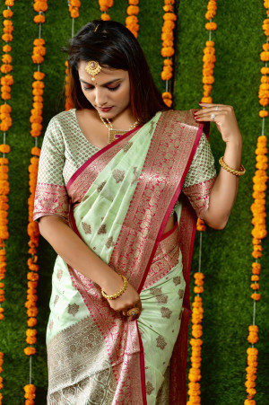 Pista green color soft linen silk saree with weaving work