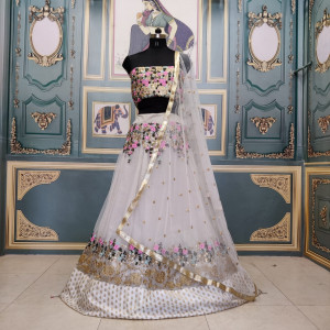 Off white color net lehenga with embroidery work