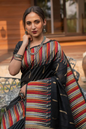Black color pure tussar silk saree with ikkat woven border