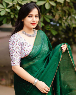 Green color dola silk saree with mirror work & aari brorder