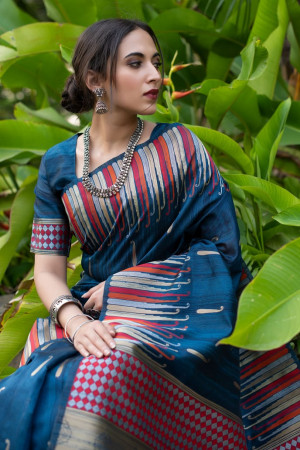 Navy blue color pure tussar silk saree with ikkat woven border