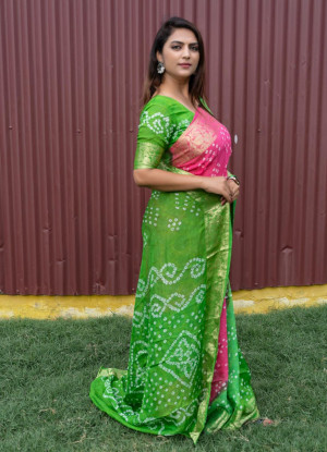 Green and pink color bandhej silk saree with zari weaving work