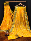 Yellow color pure hand bandhej bandhani saree with zari weaving work