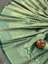 Green color banarasi silk saree with golden zari weaving work
