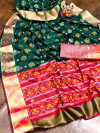 Dark green color soft patola silk saree with zari weaving work