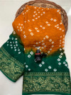 Mustard yellow and green color hand bandhej bandhani silk saree with zari weaving work
