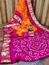 Orange and pink color hand bandhej bandhani silk saree with zari weaving work