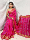 Rani pink color soft bandhej silk saree with printed work