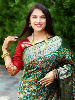 Green color patola silk saree with zari weaving work