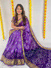 Purple color soft hand bandhej silk saree with printed work