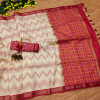Off white and red color tussar silk saree with zari woven work