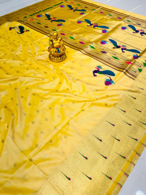 Light yellow color paithani silk saree with zari weaving work