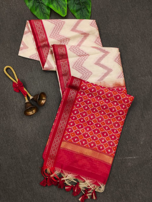 Off white and red color tussar silk saree with zari woven work