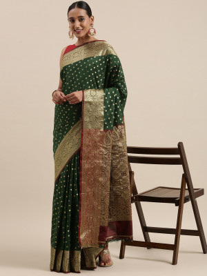 Dark green color banarasi silk saree with zari weaving work