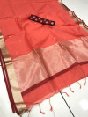 Peach color linen silk saree with checks and zari woven pallu