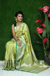 Pista green color lichi silk saree with silver zari weaving work