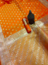 Orange color lichi silk saree with gold zari weaving work