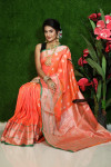 Orange color lichi silk saree with silver zari weaving work