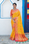 Yellow color soft banarasi silk saree with meenakari design